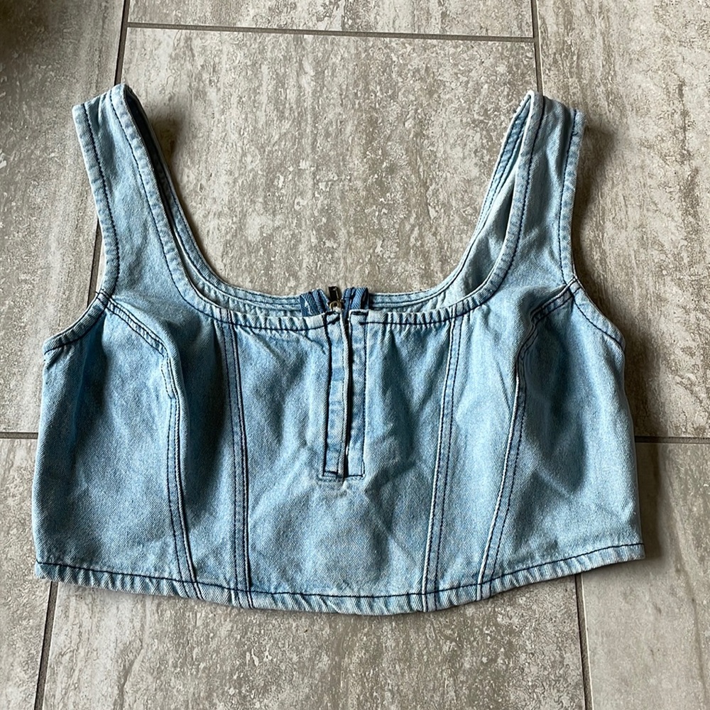 Dizzy Lizy, blue denim sleeveless cropped top with a hook & eye closure & zipper